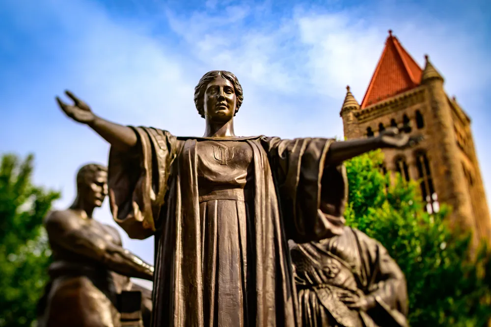 A statue with a blue sky in the backgrounds