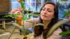 woman tending to a plant