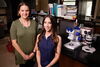 two smiling women in a lab