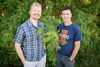 two smiling men outdoors