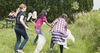 children in a field with nets