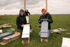 Joy O'Keefe (left) and Reed Crawford (right) with bat boxes installed for a previous study.