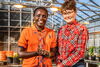 Esther Ngumbi and Erinn Dady in greenhouse