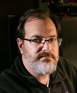 a headshot of Andrew Suarez