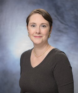 A professional headshot of Amy Marshall-Colon