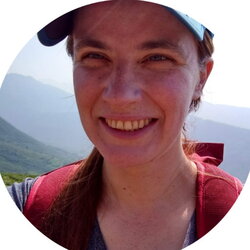 A photo of Anastasia Rahlin with mountains in the background