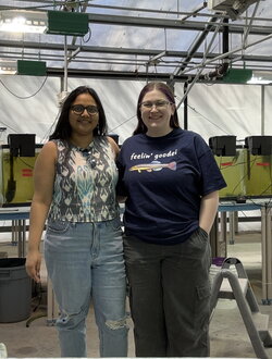 Ratna and Morgan standing side by side with each other