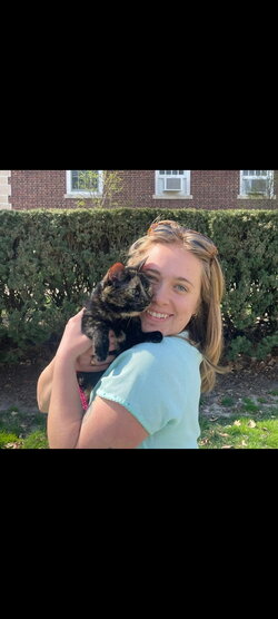 A photo of Abby Webber holding a cat