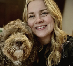 A photo of Julia Jehn with a dog