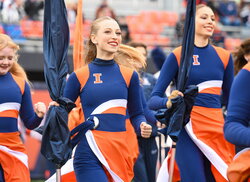 A photo of Julia Persak marching in the color guard.