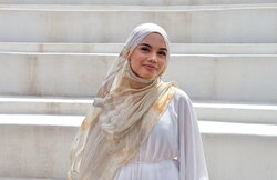 A photo of Akilah Samad standing by the krannert stairs