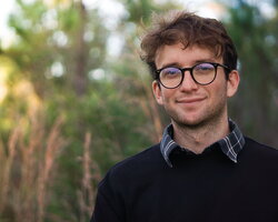 A photo of Timothy Legare standing in the woods