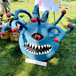 a photo of a paper machete beholder