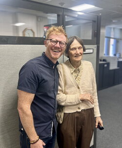 A photo of a man and a woman standing next to each other 